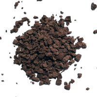 Pile of dark brown cacao grounds on a white background